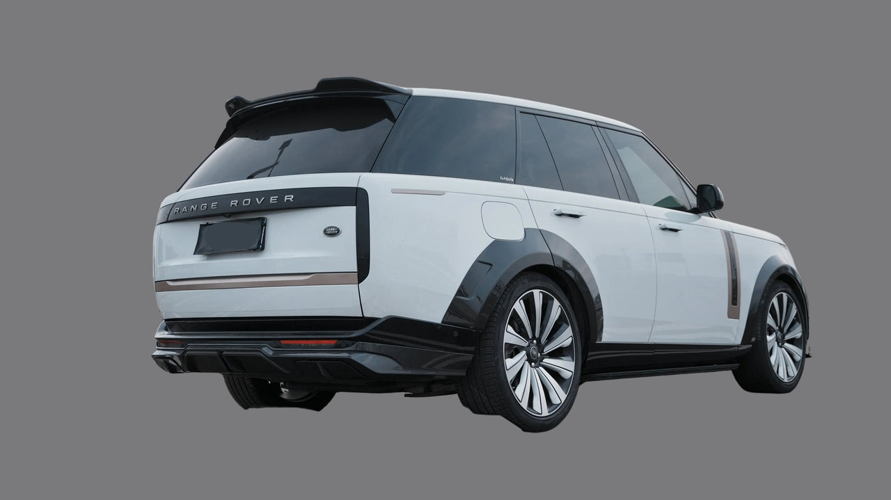Land Rover SUV parked on a road with a cityscape background